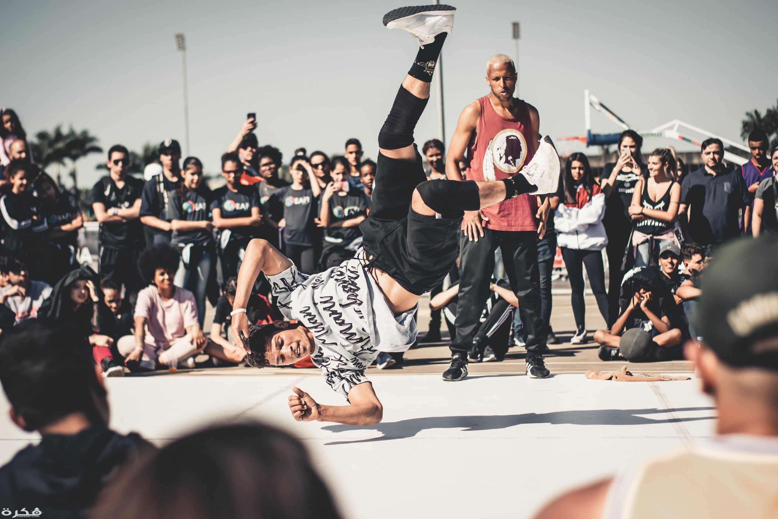 dancing man among crowd 2820898 scaled