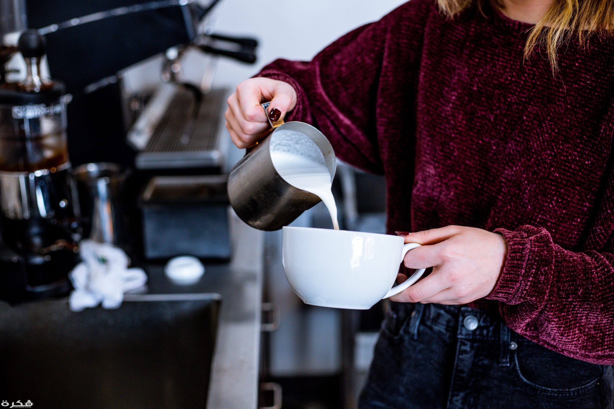 woman pouring milk on cup 1913785 scaled