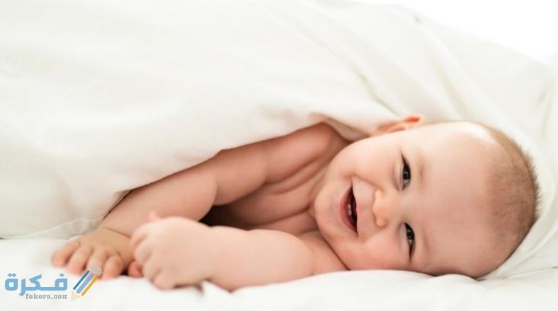 A baby wrapped inside a blanket