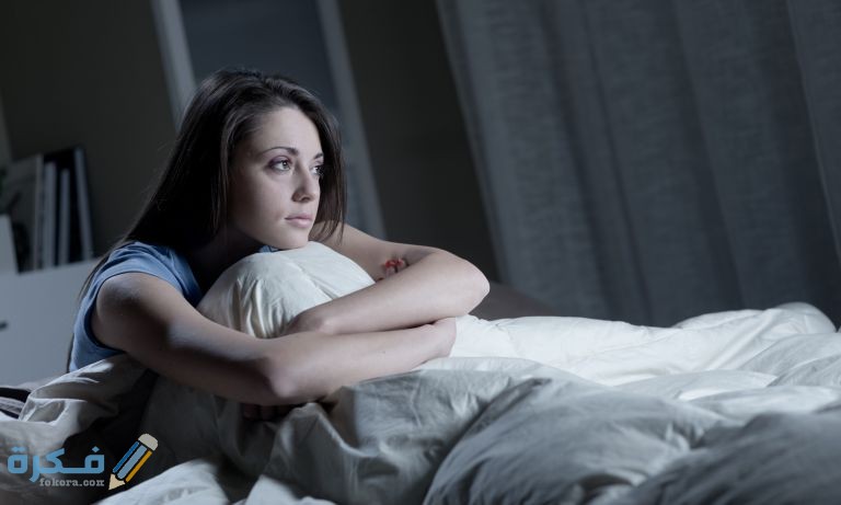 woman staring out from bed 768 1